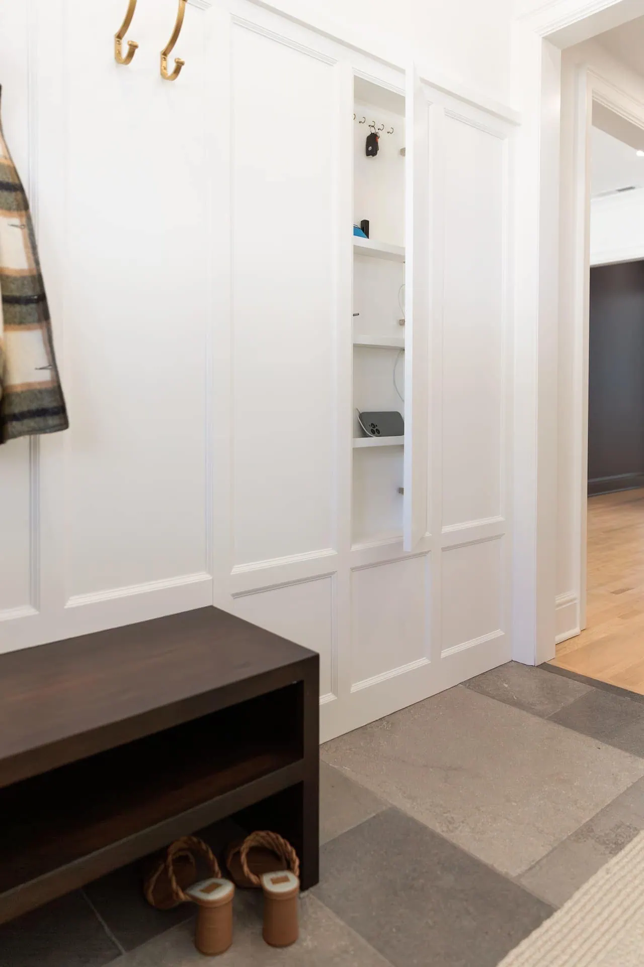 Crafting the Perfect Mudroom for Winter 4 Linden Hills Tudor mudroom featuring in-floor heating for comfort and functionality.